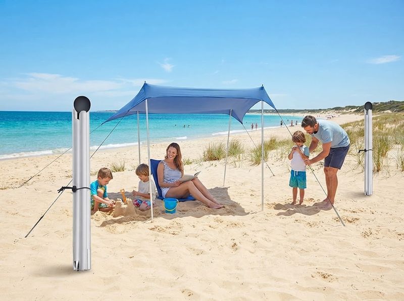 Aluminum replacement pole with a foam ball tip beside a beach canopy corner